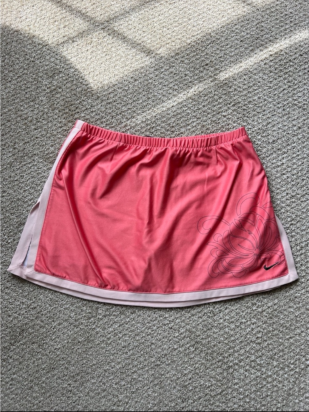 Nike Coral Pink Athletic Skort with Subtle Floral Graphic